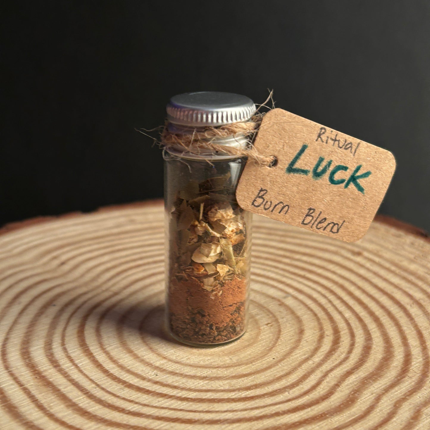 Small Glass Jar Filled With a Ritual Incense Burn Blend Labeled Luck. 
