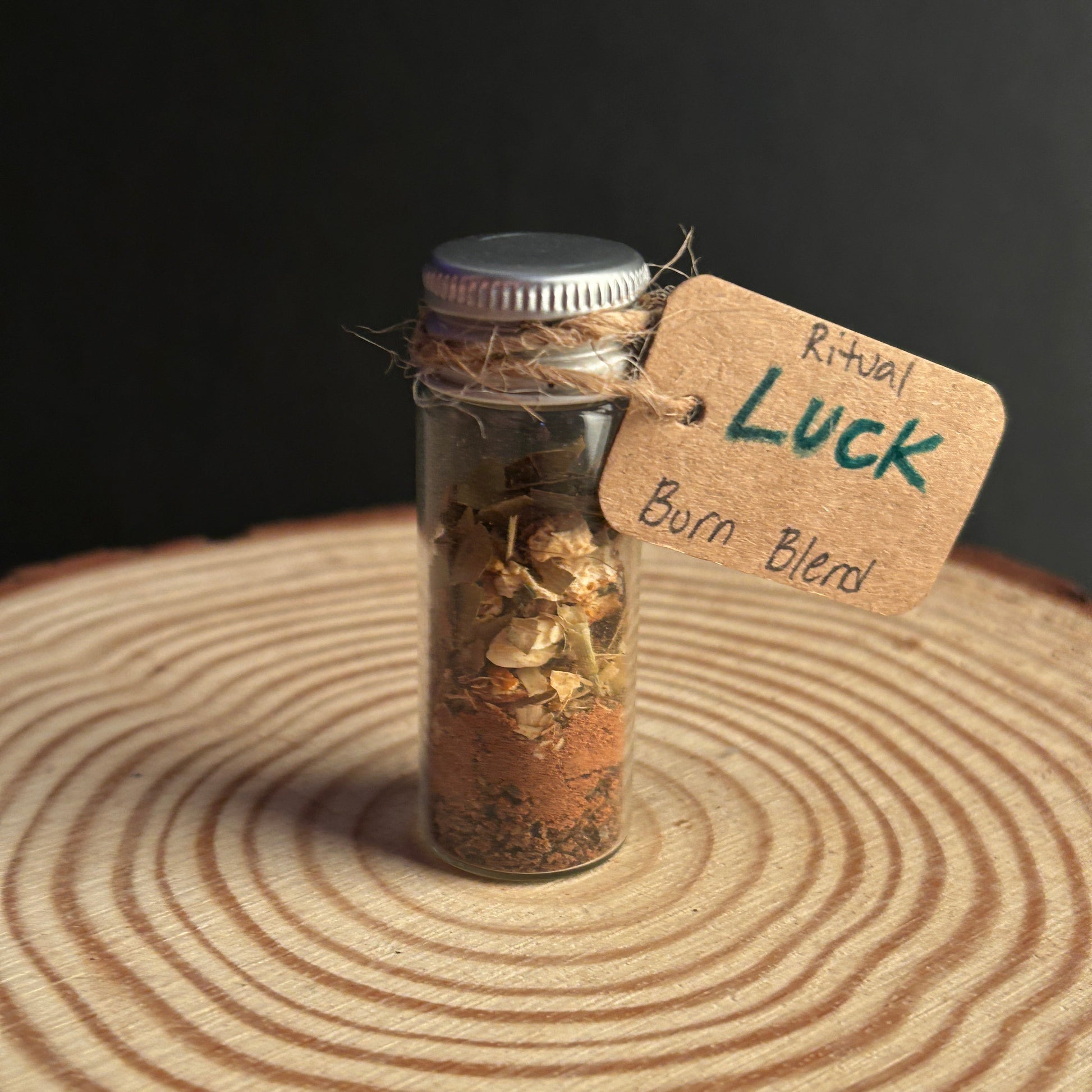 Small Glass Jar Filled With a Ritual Incense Burn Blend Labeled Luck. 